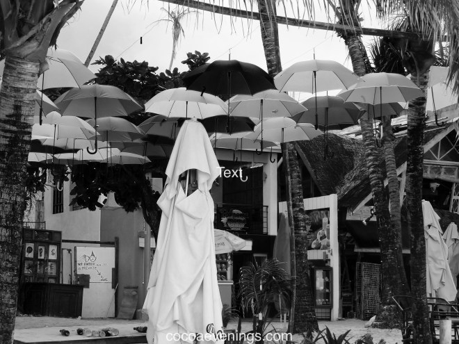 white-figure-under-umbrellas-DSC01340