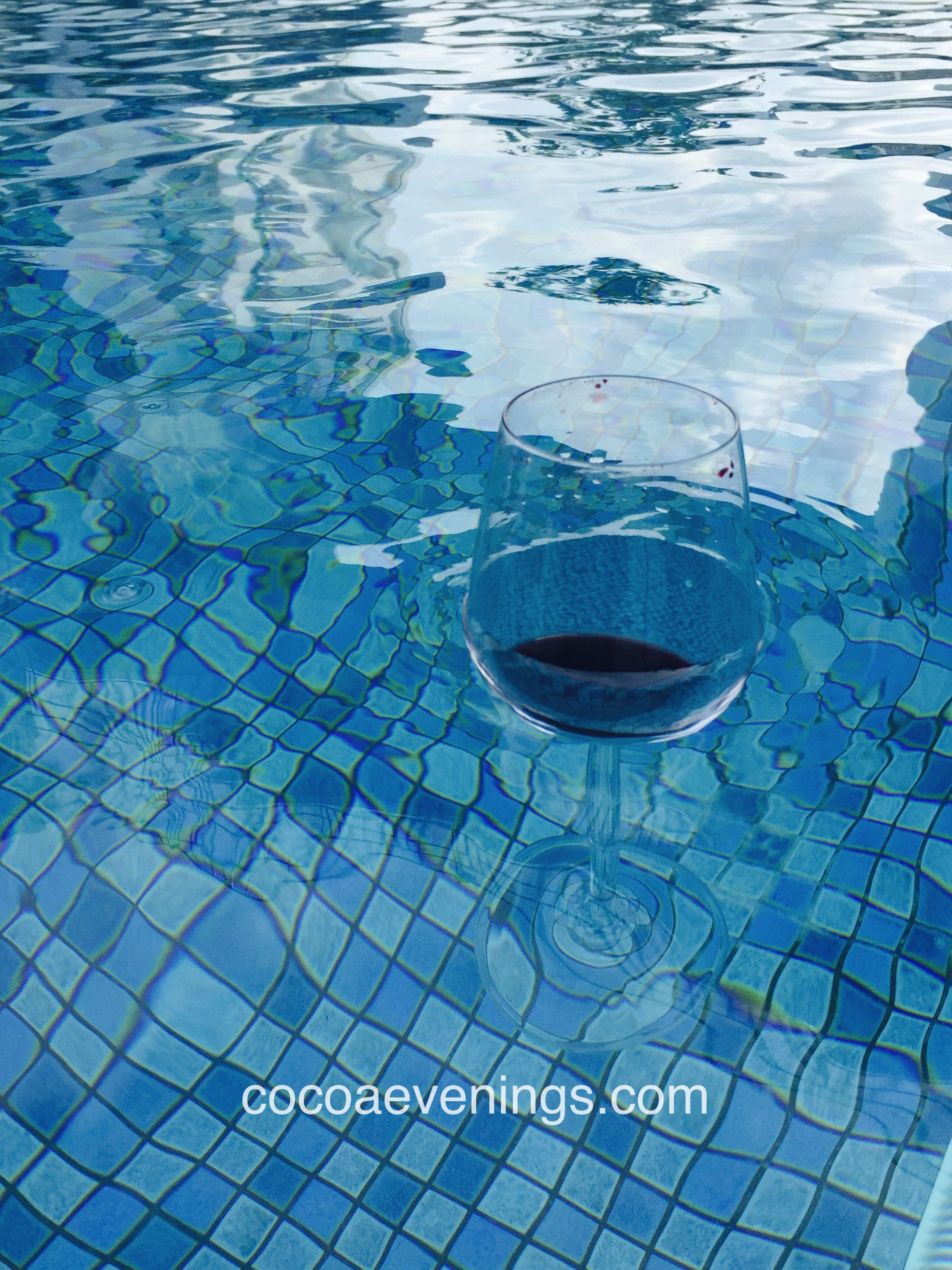 red-wine-crystal-glass-floating-water-swimming-pool